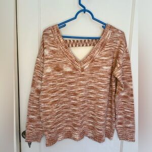 Medium Maurice’s muted orange sweater with V cutout in front and back